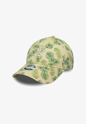 Baseballmütze aus beigem Stoff mit grünen Blattmustern. Mit gesticktem Logo auf der Vorderseite und gebogenem Schirm. New Era Etikett angebracht.