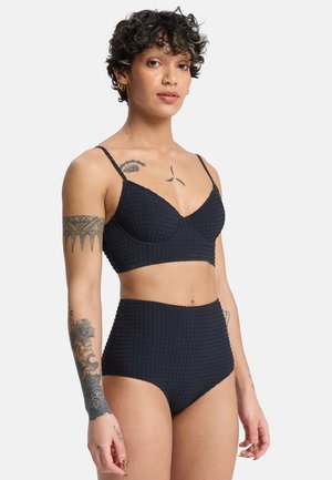 Black textured bikini set featuring a structured bralette top and high-waisted bottom. Features adjustable straps and a subtle checkered pattern.