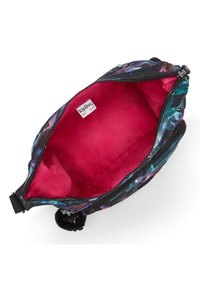 Black floral print bag with a vibrant pink interior, zip closure, and a pom-pom accent. Smooth fabric, compact shape, and lined inside.