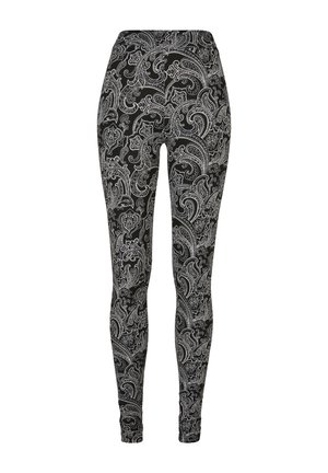 Svarte leggings med et intrikat hvitt paisley-mønster, med en elastisk midje og figurnært design. Mykt stoff med jevn tekstur.