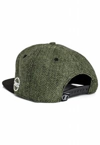 Green herringbone-patterned cap with a black visor, adjustable snapback closure, and a white embroidered logo on the side.