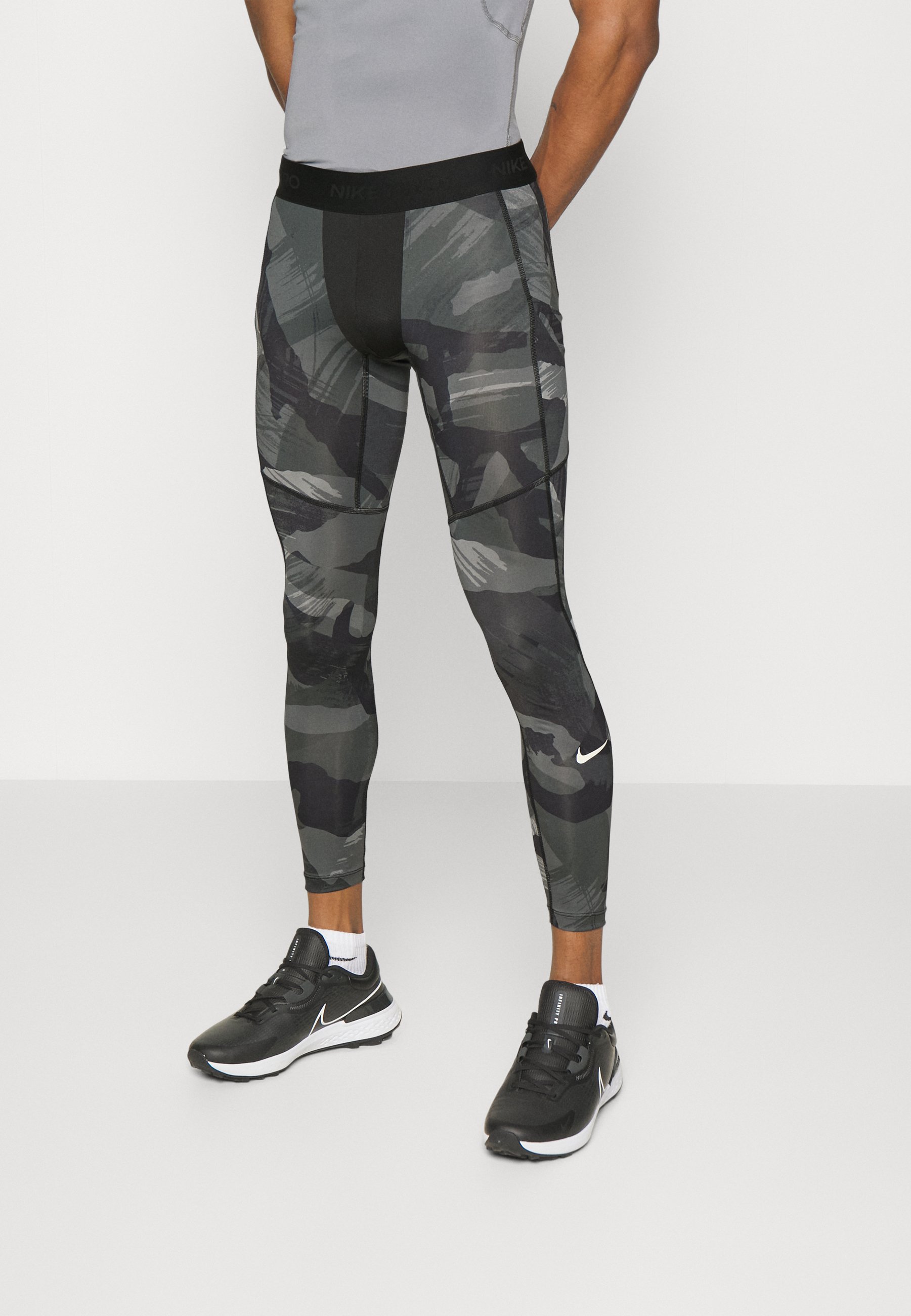 Nike Performance CAMO - Leggings - black 