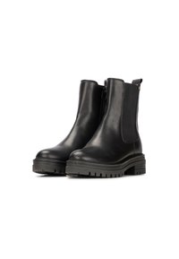 Botas de cuero negro hasta el tobillo con paneles laterales elásticos, una suela de goma texturizada y un ligero tacón para tracción y estabilidad.