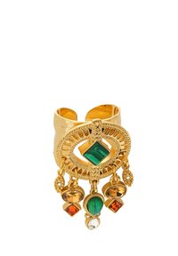 Gold-tone cuff bracelet featuring intricate circular design, green and amber colored gemstones, and dangling accents with textured details.
