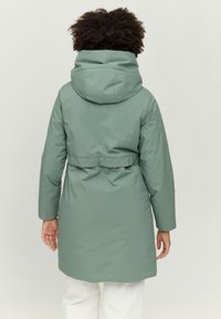 Light green puffer coat with a hood, belted at the waist, long sleeves, and a smooth, shiny texture. Features a mid-length design.