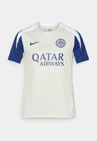 White and navy Nike football shirt featuring short sleeves, crew neck, Qatar Airways logo, and circular interlocking club emblem on chest.