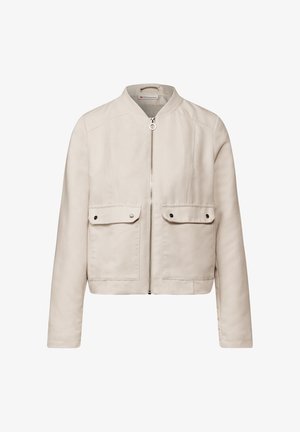Veste bomber beige avec fermeture éclair, deux poches avant et un col rond. Fabriquée dans un tissu lisse et texturé. Design minimaliste.