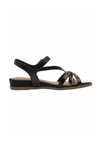 Sandales noires à finition brillante, dotées de brides croisées et d'un accent imprimé léopard. Talon compensé texturé pour un soutien supplémentaire.