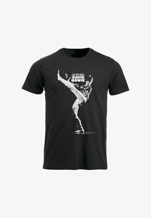 T-shirt in cotone nero con una grafica bianca di una persona in fase di calciata, con il testo "L'UOMO CHE HA VENDUTO IL MONDO" e "DAVID BOWIE."