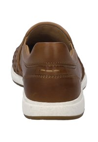 Brown leather sneaker with a textured design, flat heel, and white rubber sole. Features stitching detail along the back and sides.
