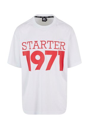 Valge lühikeste varrukatega t-särk, mis on valmistatud puuvillast, millel on silmapaistev punane trükk, mis ütleb "STARTER 1971" ees. Ümar kaelus.