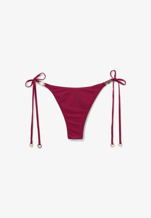 Maroon bikini bottom with adjustable ties, featuring round metallic accents at the hip, smooth texture, and minimal coverage design.