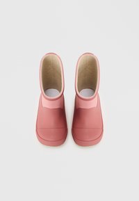 Botas de borracha cor-de-rosa com uma superfície lisa e design de perfil baixo. Forro isolante e biqueira redonda. Apresenta um eixo mais largo para fácil utilização.