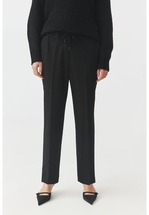 Spodnie materiałowe