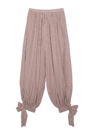 Pantalon ample avec taille élastique, motif à carreaux beige et rouge, et nœuds attachés aux poignets resserrés aux chevilles.