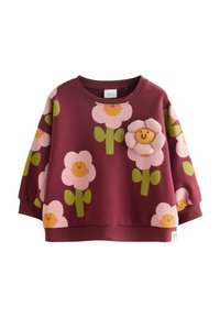 Burgundi pulóver rózsaszín és zöld virágmintákkal. Dombornyomott virágappliqué található a mellrészen. Kerek nyakú és laza szabású.