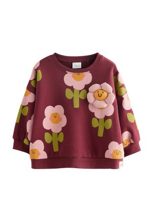 Felpa bordeaux con motivi floreali rosa e verdi. Presenta un'applicazione floreale a rilievo sul petto. Collo rotondo e vestibilità morbida.