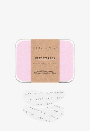 Återanvändbara silikonögonplåster i en rosa plåtburk med en pappersetikett. Plåstren är genomskinliga med svart text. Burken har en mönstrad insida.