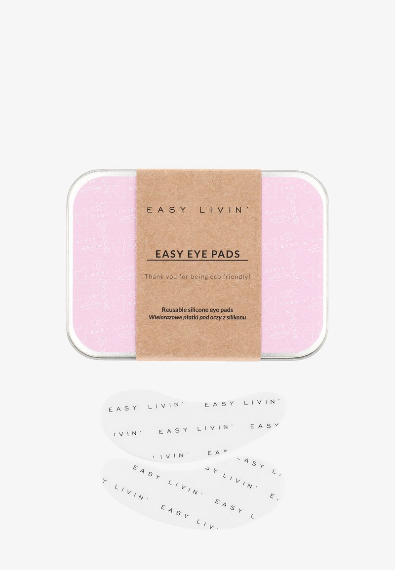 Wiederverwendbare Silikon-Augenpads in einer rosa Dose mit einem Kartonlabel. Die Pads sind transparent mit schwarzem Text. Die Dose hat ein gemustertes Innenleben.
