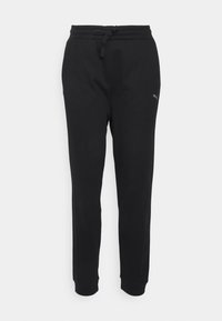 Pantalones de chándal negros con cintura elástica y cordón. Presentan tobillos ajustados y un pequeño logotipo en la pierna izquierda. Tejido suave y liso.
