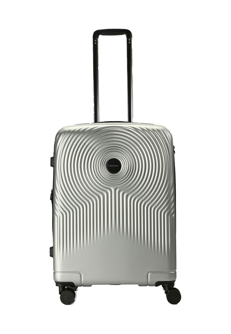 Silberner Hartschalenkoffer mit konzentrischen Kreis- und Linienmustern, schwarzem Teleskopgriff und vier schwarzen Spinner-Rädern.