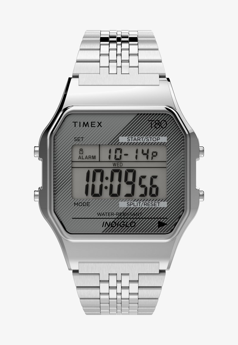 Cyfrowy zegarek na rękę z bransoletem ze stali nierdzewnej, ośmiokątną srebrną kopertą, szarym wzorzystym cyferblatem oraz podświetlanym wyświetlaczem. Posiada przyciski do ustawień.