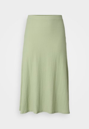 Svetlozelená sukňa po kolená vyrobená z textúrovanej látky, s hladkým pásom a mierne rozšíreným strihom. Bez vzorov alebo akcentov.