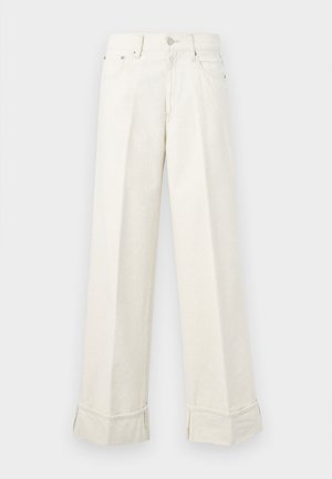 Wijduitlopende crèmekleurige broek van katoen, met een dubbele zoom en riemlussen. Ontworpen met twee zijzakken en een knoopsluiting aan de voorkant.