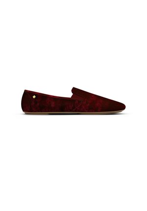 Burgundy velvet slip-on shoes with a smooth texture and a low profile, featuring a discreet logo accent on the side and a light sole.