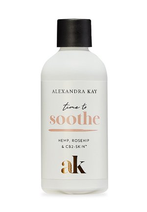White plastic bottle with a black cap, labeled "time to soothe" in varying fonts. Ingredients include hemp and rosehip. Gold accent on label.