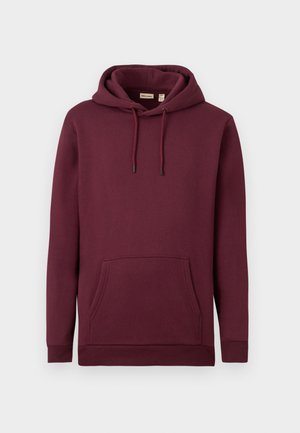 Burgundska kapučinova majica iz mehkega blaga, ki ima sprednji žep in vrvico z črnimi konicami; riban rob in manšete.