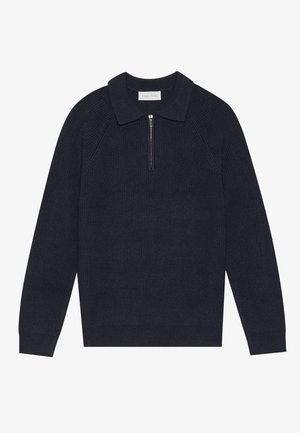 Tumesinine pullover-svett, millel on sooniline tekstuur, krae ja pooltõmblusega esipaneel. Omab pikki varrukaid ja tihedat helmeid. Valmistatud pehmest kangast.
