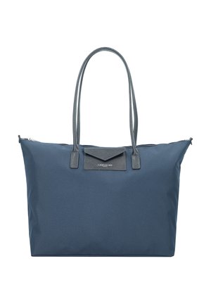 Navy tote bag made of durable fabric with two shoulder straps, a zip closure, and a structured shape. Features a triangular accent on the front.