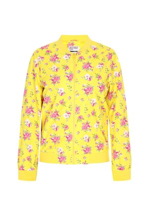 Kvetinová bomber bunda v jasne žltej farbe s ružovými a bielymi kvetmi. Obsahuje zips, ribované manžety a textúrovanú tkaninu.
