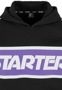 Black hoodie with a large, white-bordered purple "STARTER" logo across the chest. Fabric appears smooth with a standard hood design.