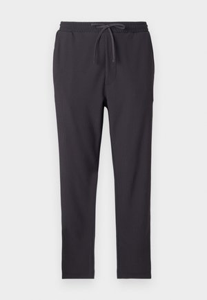Donkergrijze jogger broek met een elastische tailleband, koordsluiting, zijzakken en een ribbelstructuur over de gehele lengte.