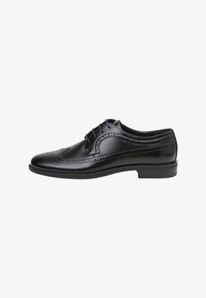 Scarpa da uomo in pelle nera con design brogue, caratterizzata da dettagli traforati, chiusura con lacci, punta arrotondata e suola texturizzata per una maggiore aderenza.