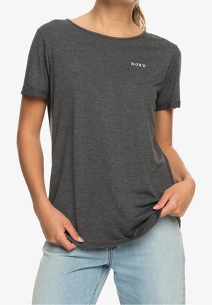 Graues T-Shirt mit kurzen Ärmeln aus weichem Stoff, mit lockerer Passform und rundem Ausschnitt. Kleines weißes "ROXY"-Logo auf der Vorderseite.
