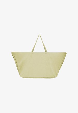 Suur, hele rohelise värviga kott kahte pikka käepidet, kolmnurksete külgedega, valmistatud kangast, millel on lihtne, kaunistusteta disain.