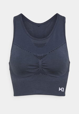 Mørkeblå sports-bh laget av mykt stoff, med rund halslinning, subtil rynkedetalj og ventilasjonshull for pusteevne.