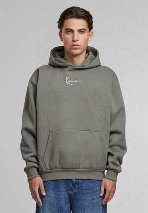 Grey hooded sweatshirt with a front pouch pocket, ribbed cuffs, and hem. Features white logo on the chest. Fabric appears soft and textured.