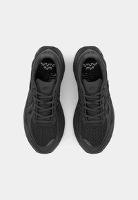 Black athletic shoes with a breathable mesh upper, textured detailing, and a cushioned sole. Lace-up design with reflective accents.