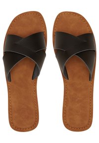 Black leather slide sandals feature crossed straps over a brown faux suede footbed, with a flat sole and stitching detailing.