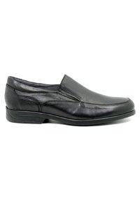 Zapato negro de piel tipo mocasín que presenta una textura suave, puntera redondeada, detalles de costura sutiles y una suela de goma de perfil bajo.