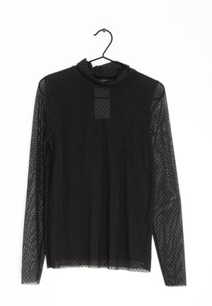 Top a maniche lunghe nero realizzato in tessuto trasparente con pois testurizzati. Presenta un collo alto e un pannello sul petto, che mostra una leggera lucentezza.