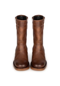 Braune Leder-Stiefeletten mit glatter Oberfläche, runder Zehenpartie und Anziehschlaufen an jeder Seite. Geschäftsnaht an der Sohle sorgt für Langlebigkeit.