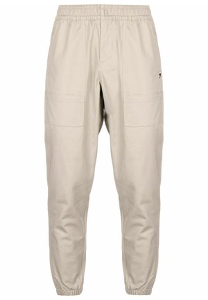 Beige cargo pants with elastic waistband, two side pockets, and cuffed ankles. Made from a lightweight, durable fabric.