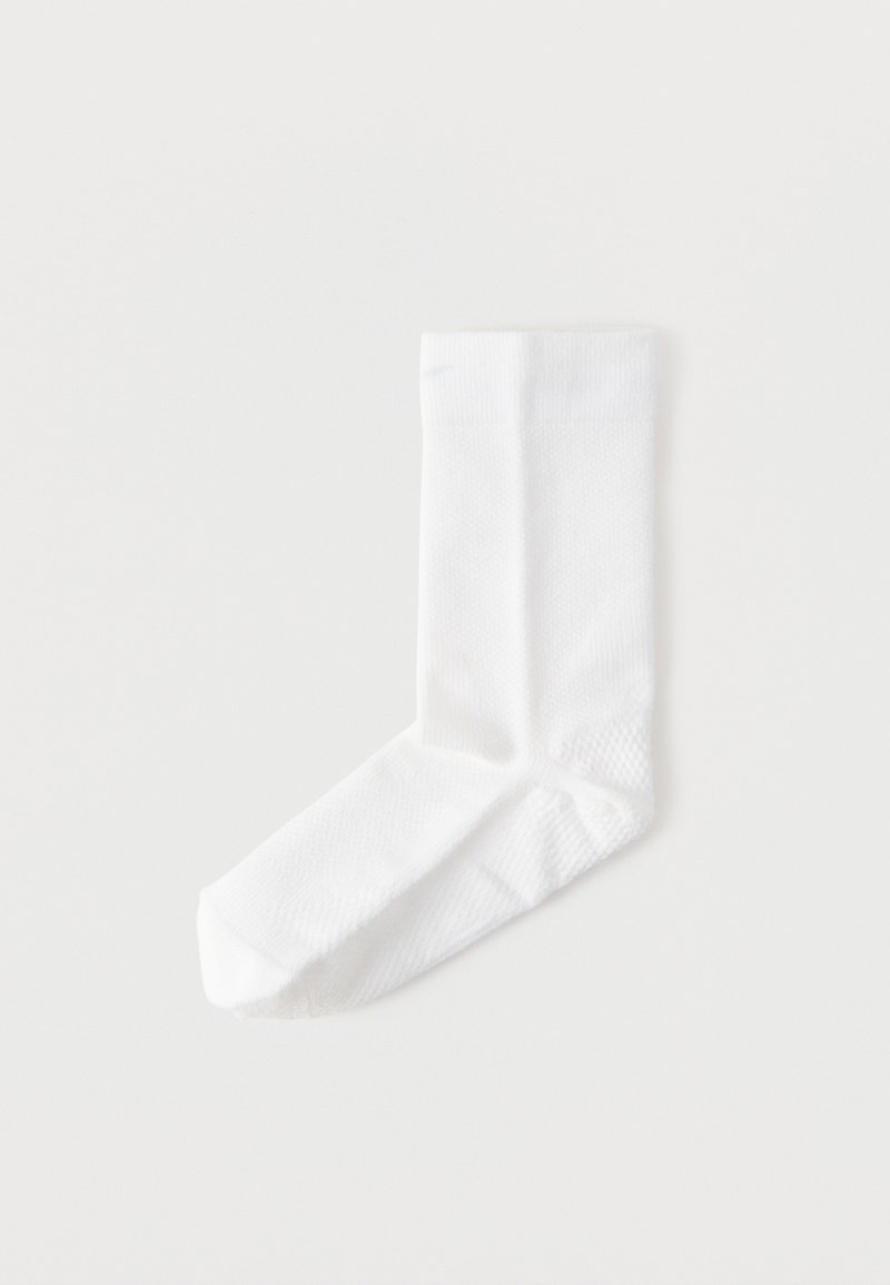 White cotton sock with a textured pattern, featuring a ribbed cuff and a standard shape suitable for everyday wear.