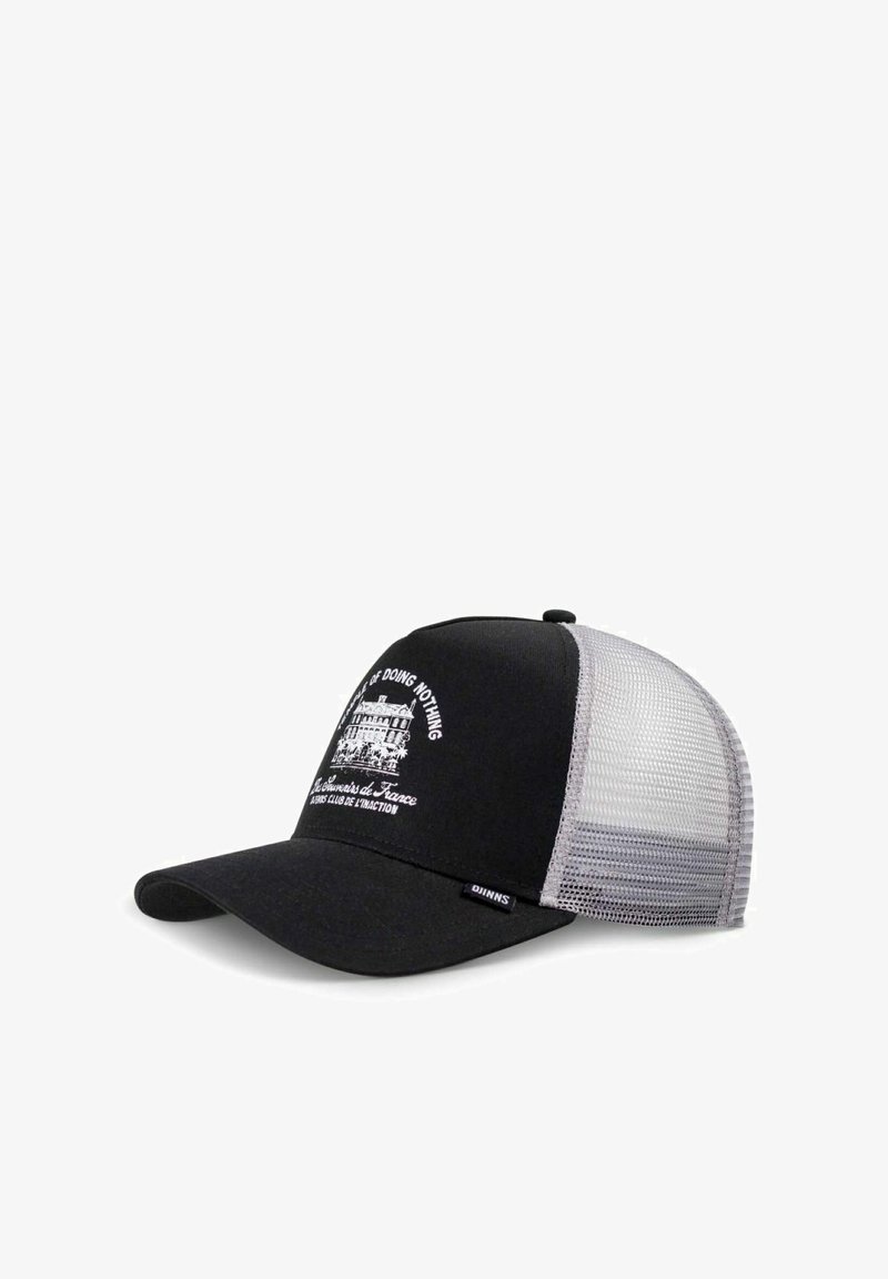 Black trucker cap with a curved brim, mesh gray paneling, and white text featuring a graphic design of a building.