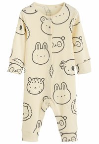 Keltainen ribattu haalarimalli, jossa on eläinten kasvoja mustalla ääriviivalla, mukaan lukien karhu, kani ja leijona. Edessä nappikiinnitys ja pitkät hihat.